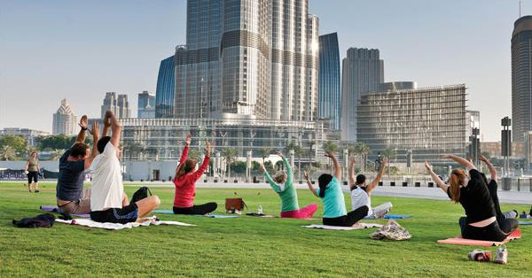 A view of a park in Jumeirah Lakes Towers with people exercising