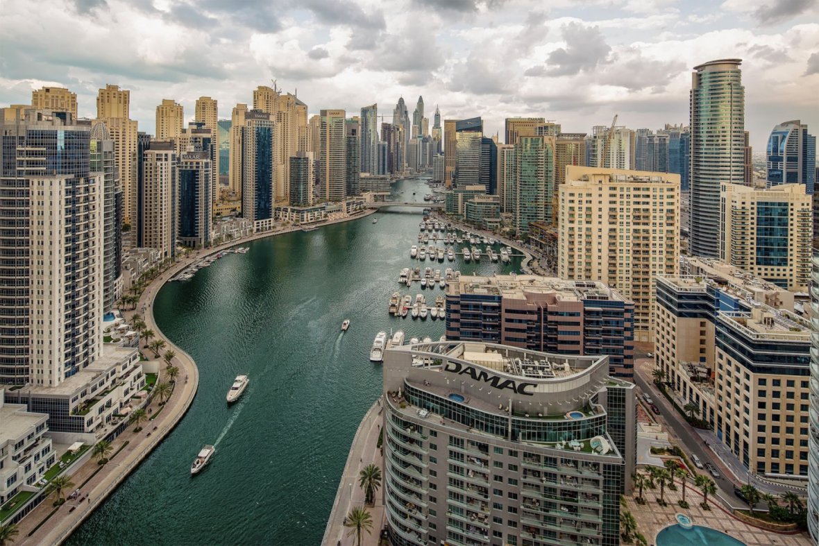 Aerial view of Dubai Marina Mall with high rise buildings, luxury apartments and residential towers conveniently located in Dubai Marina area