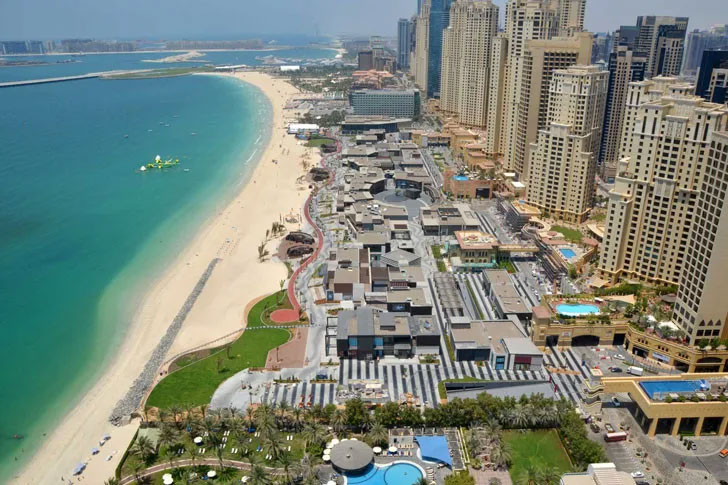 Aerial view of Jumeirah Beach Residence with many hotels, restaurants and water sports