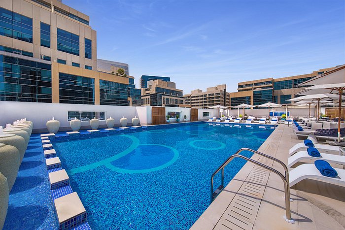 Hilton Dubai hotel with outdoor pool and fitness centre