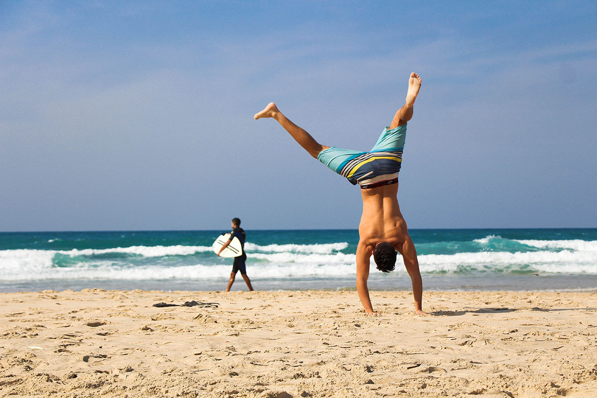 A person wearing beachwear at Jumeirah Beach in Dubai